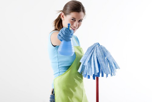 Cleaning staff applying safety procedures in a commercial setting