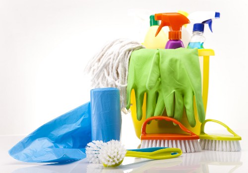 Worker using protective equipment while handling cleaning products